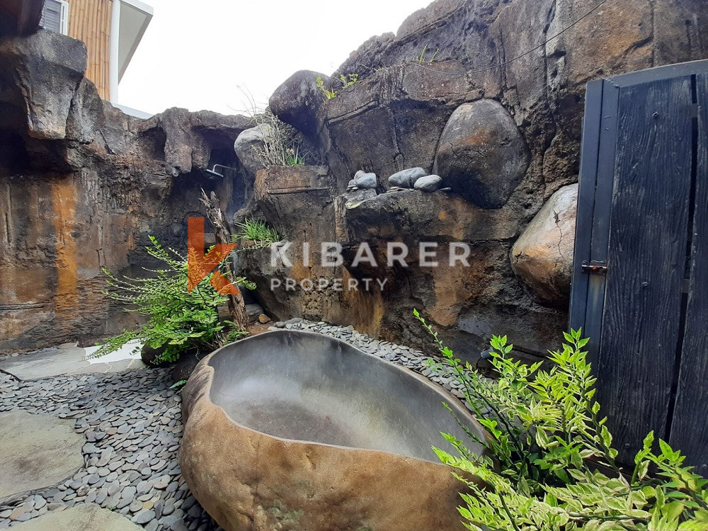 Unique Three-Bedroom Villa with Natural Stone Design and Forest in Umalas — image 9