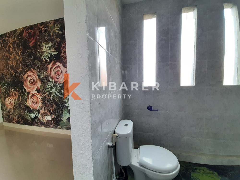 Unique Three-Bedroom Villa with Natural Stone Design and Forest in Umalas — image 11
