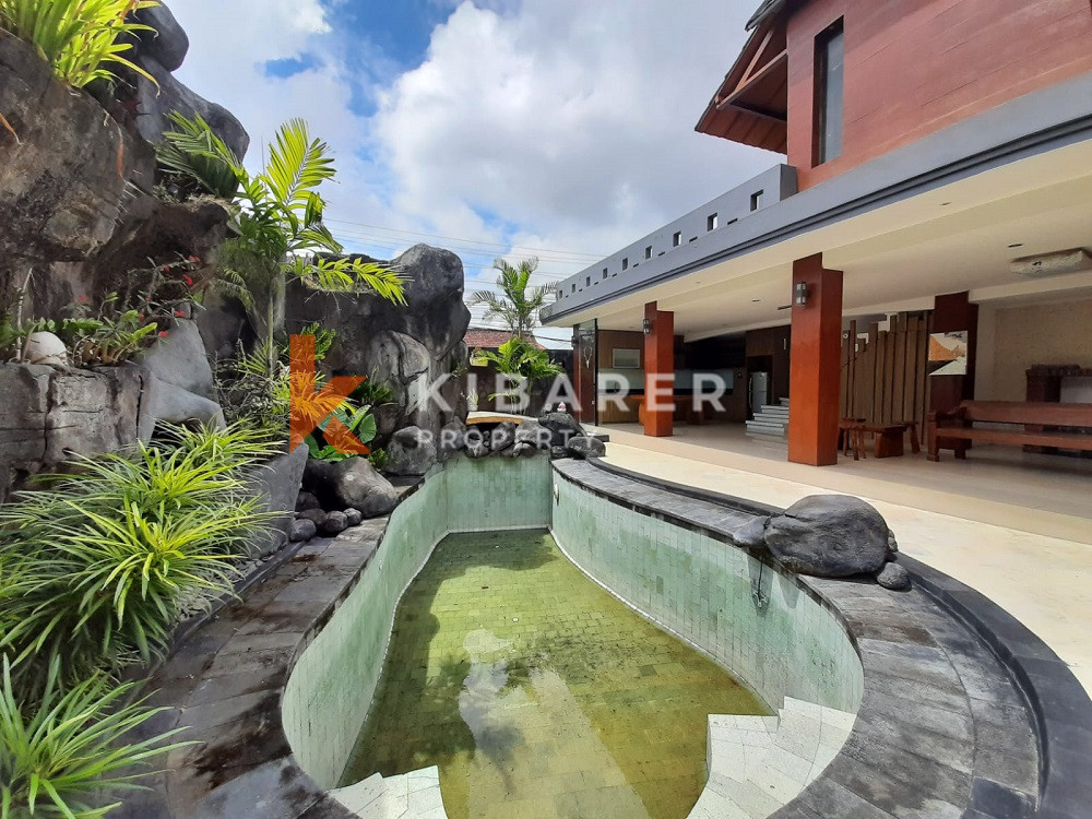 Unique Three-Bedroom Villa with Natural Stone Design and Forest in Umalas — image 1