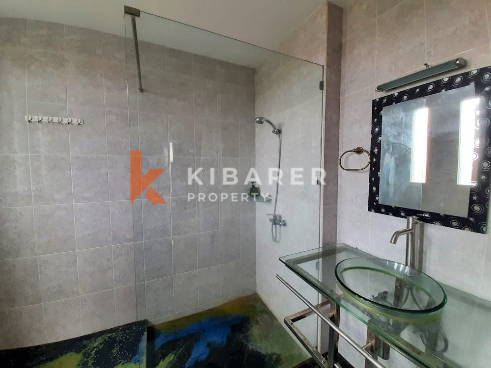 Unique Three-Bedroom Villa with Natural Stone Design and Forest in Umalas — image 12
