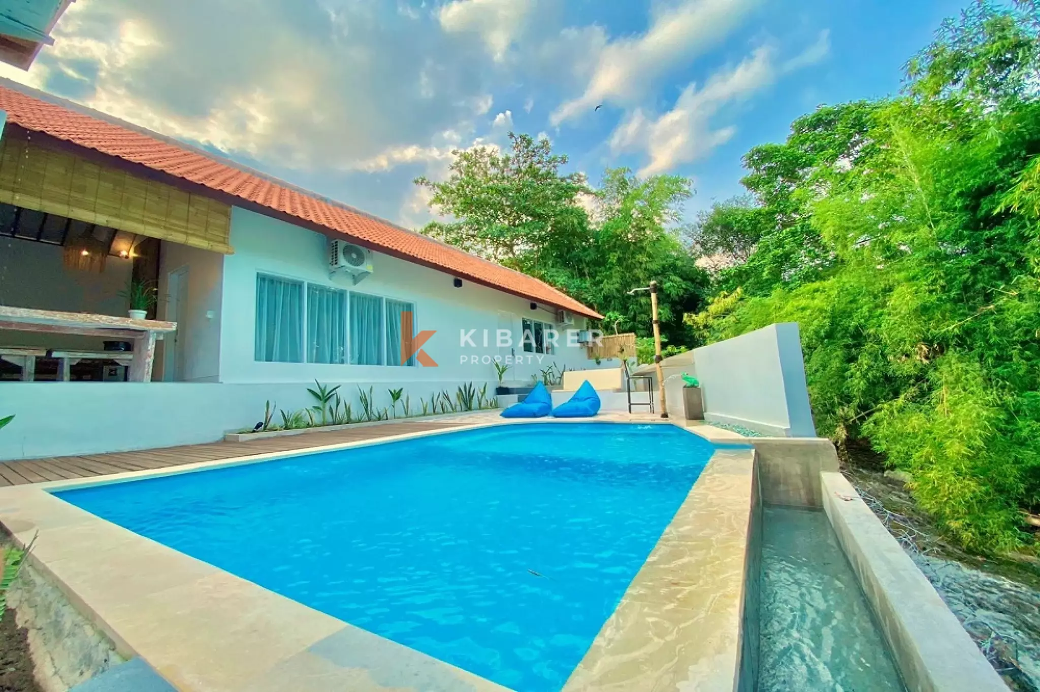 Three-Bedroom House with River View and Open Living Space in Canggu — image 1
